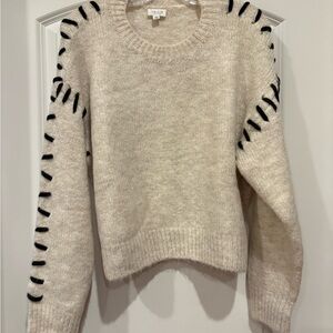 Cozy Cream Sweater with Black Accents